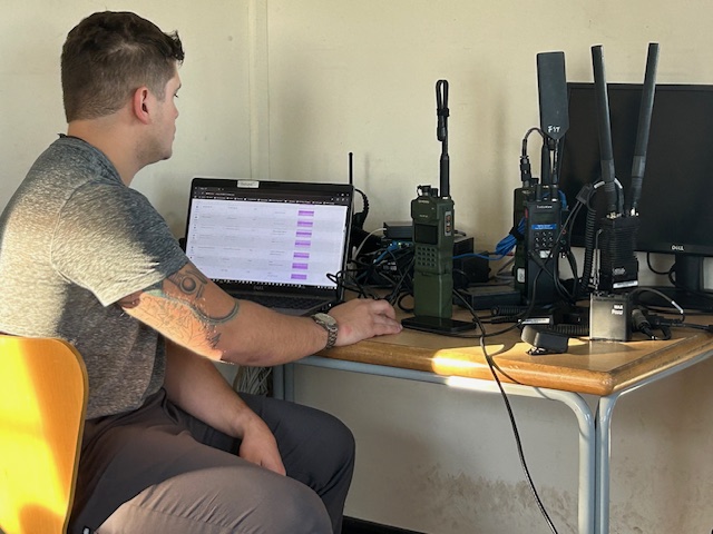 Man testing REDCOM Sigma software at the AWE