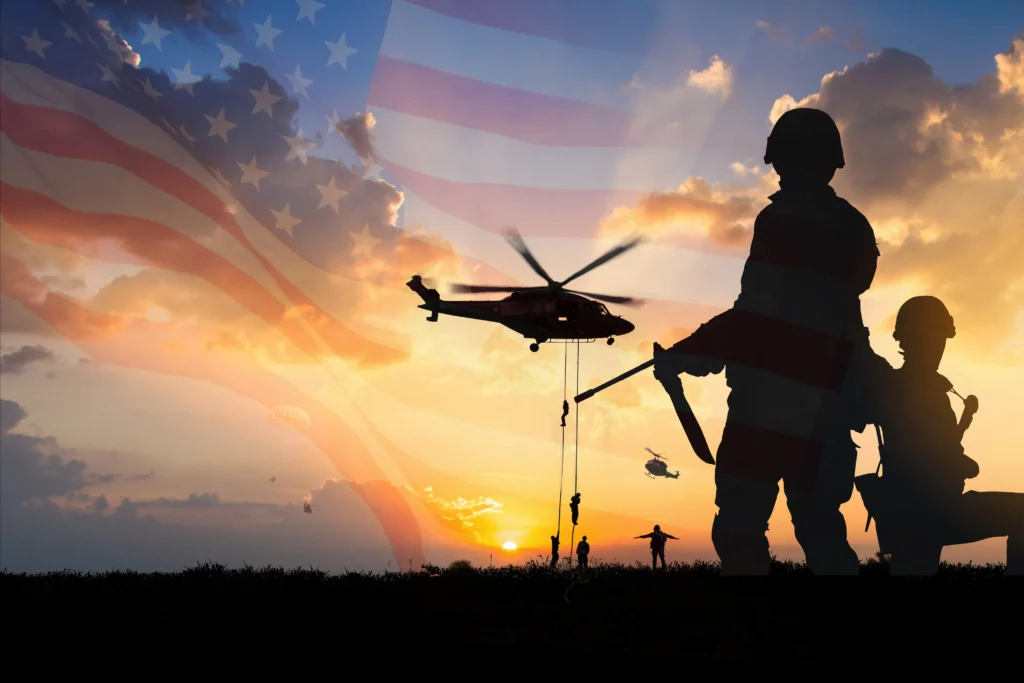 Soldiers near american flag with drones and helicopter in the distance